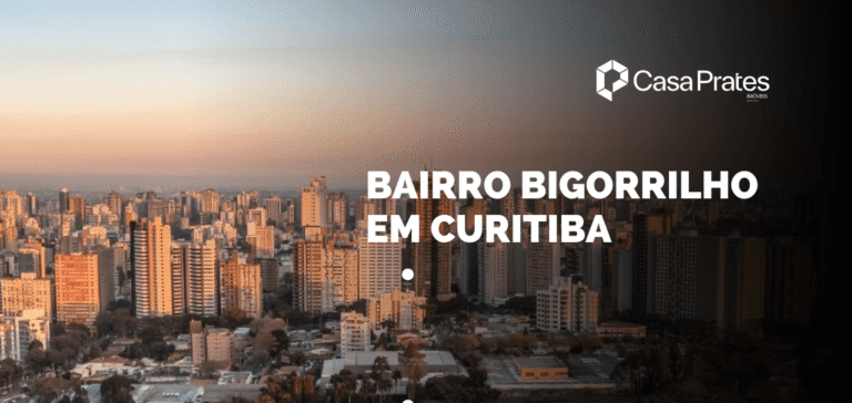 Vista panorâmica do Bairro Bigorrilho em Curitiba ao entardecer, com prédios residenciais de alto padrão e skyline urbano em destaque em material da Casa Prates Imóveis.
